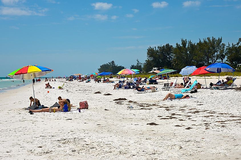 Beachgoers enjoying the sun on the beach in Anna Maria Island