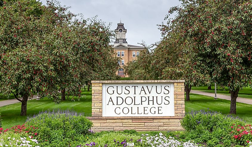  Entrance sign and Old Main clock on the campus of Gustavus Adolphus College.