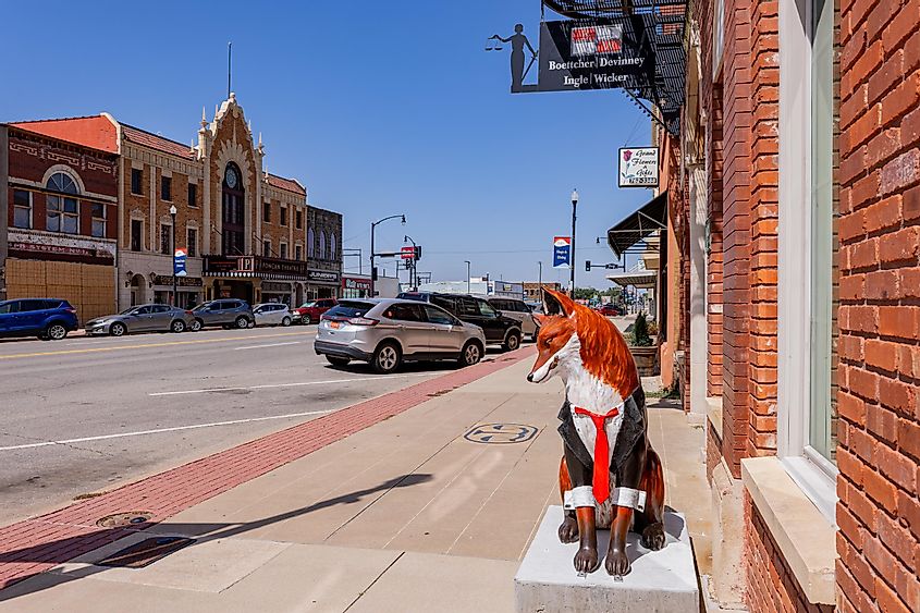 Sunny exterior view of the Ponca City downtown with a close up of a fox statue
