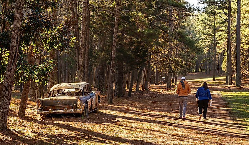 A couple walks on the Occoneechee Speedway Trail