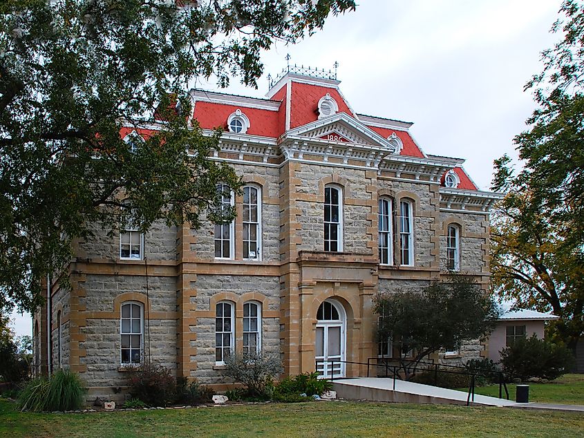 The Concho County Courthouse in Paint Rock, Texas, a historic stone building with classic architectural features.