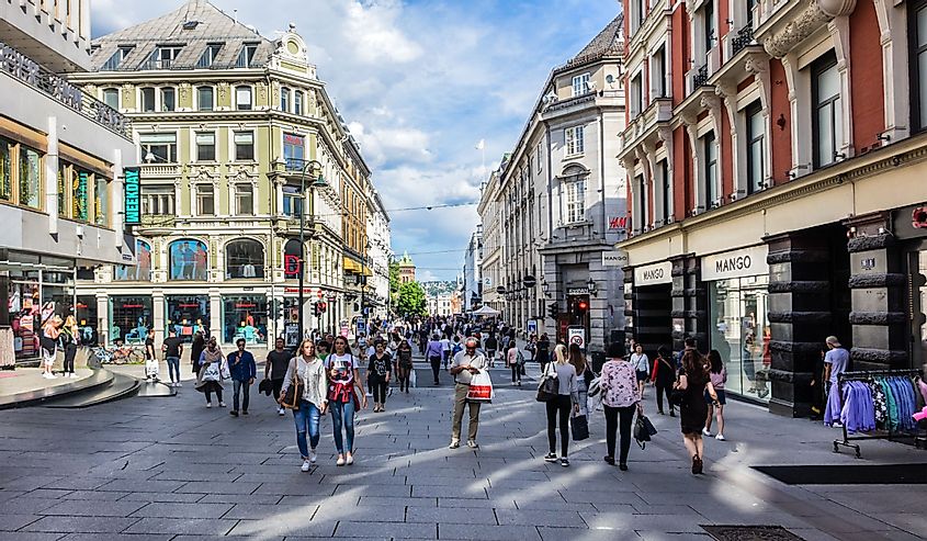  Tourists and locals walk in the Oslo city center streets, Norway