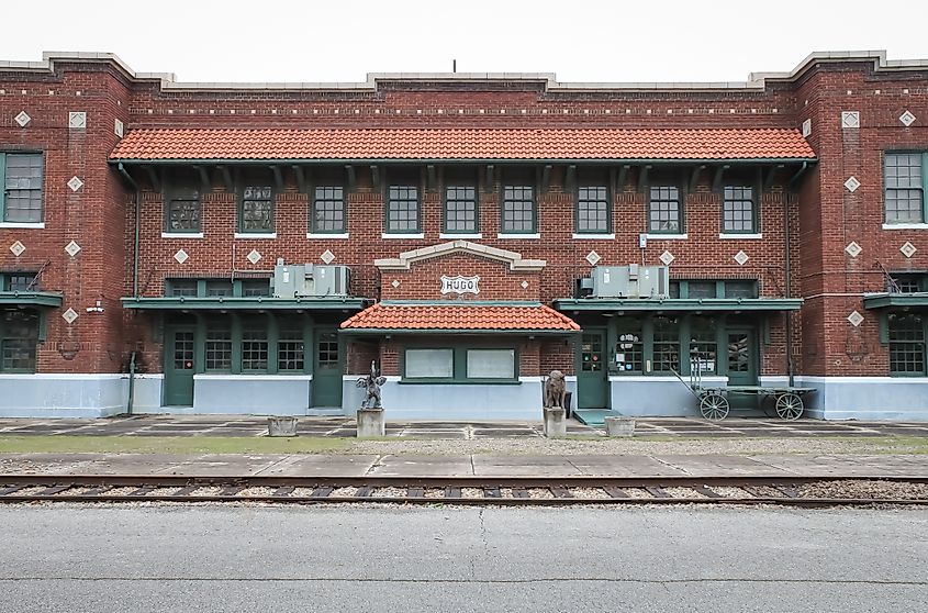 A brick train station building with a tiled roof in Hugo, Oklahoma. Editorial credit: Sabrina Janelle Gordon / Shutterstock.com