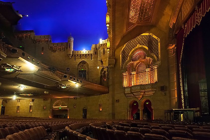Panoramic view of the stalls, stage and blue lightened ceiling of the Oriental style decorated Fox Theater, Midtown. Via Conchi Martinez.
