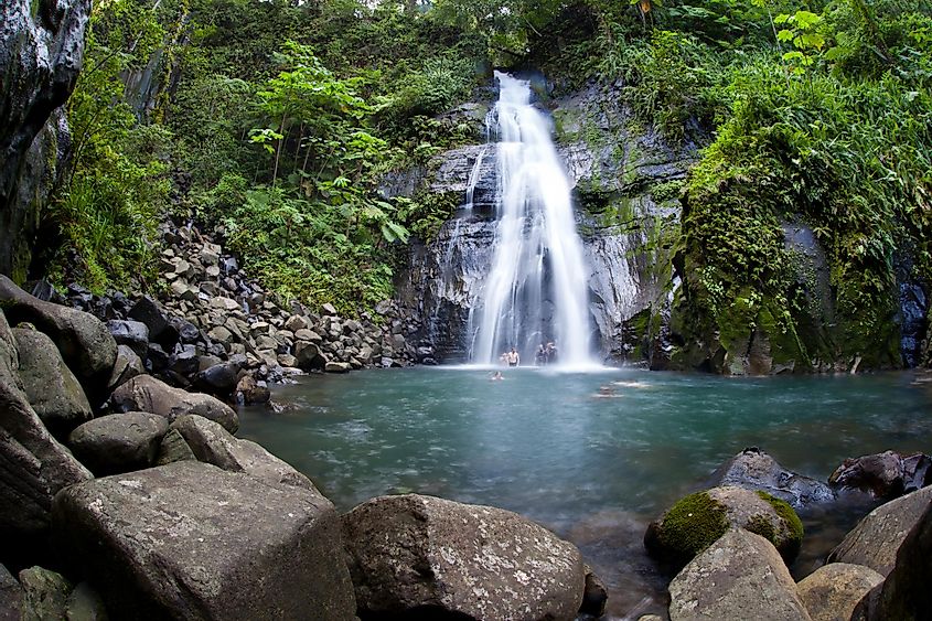 A waterfall cascades into a large pool on Cocos Island, Costa Rica. 