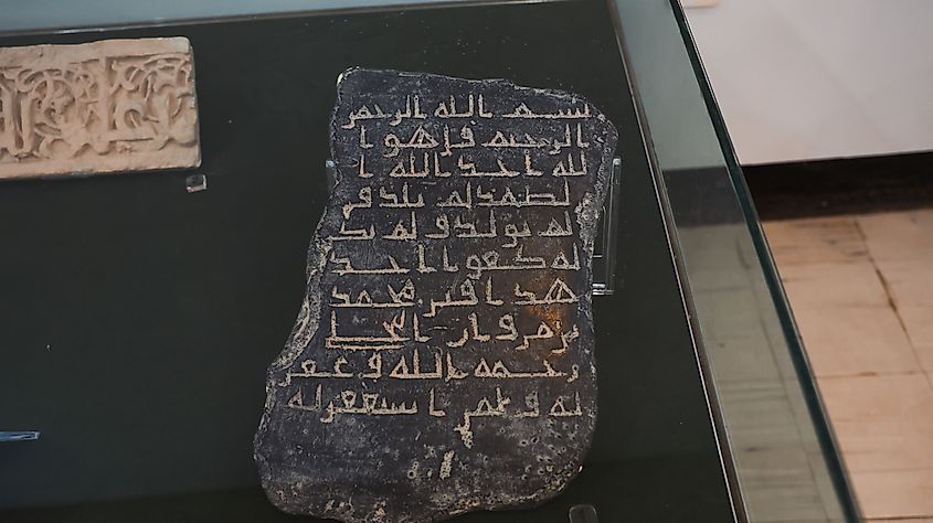 Ancient artifact with inscriptions on display in Babylon.