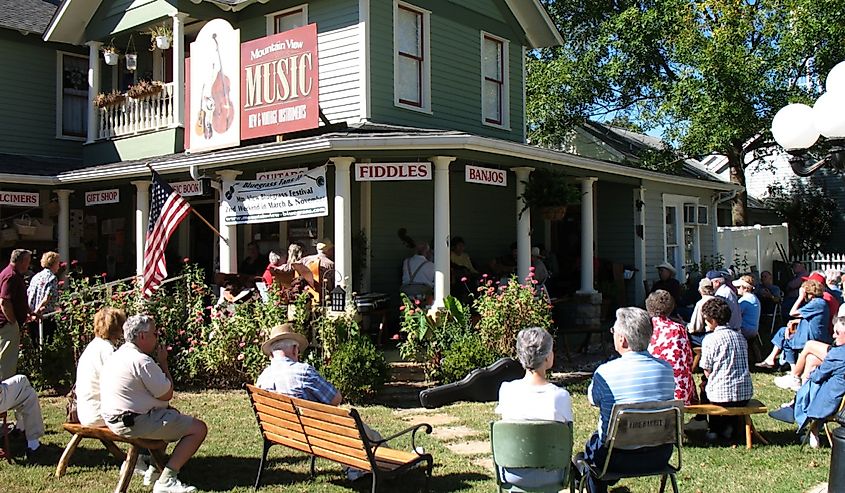 People sitting around listening to folk music in Mountain View Arkansas