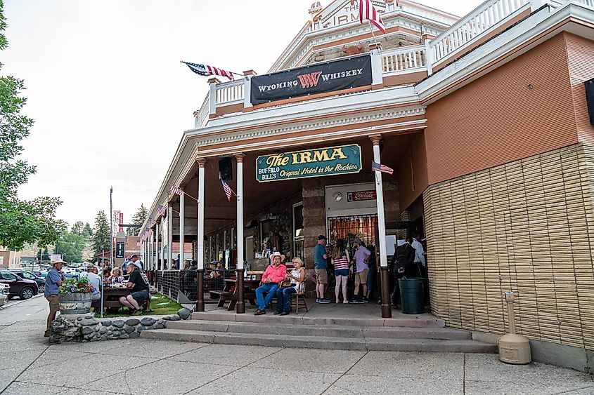 People gather outside the famous Irma Restaurant and grill in the downtown area, via melissamn / Shutterstock.com