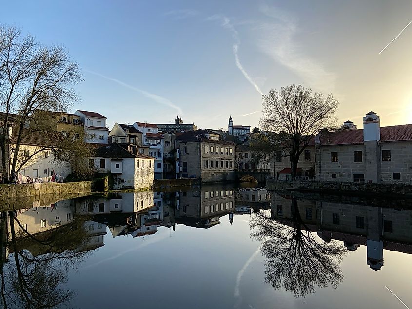 Historic buildings across a lake in Viseu, Portugal