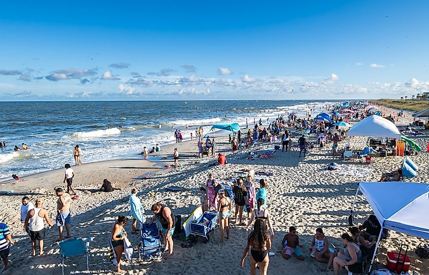 People enjoying a busy day by the beach in Tybee Island, Georgia
