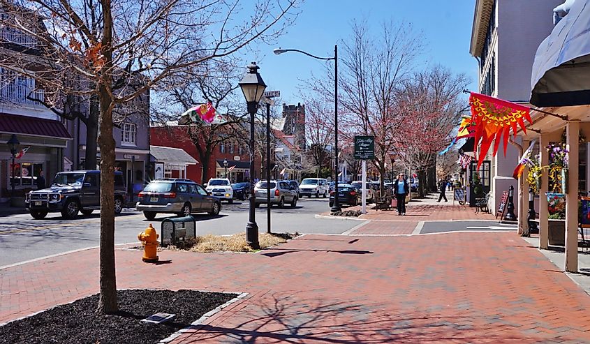 The historic town of Haddonfield, New Jersey with flags and cars on the street