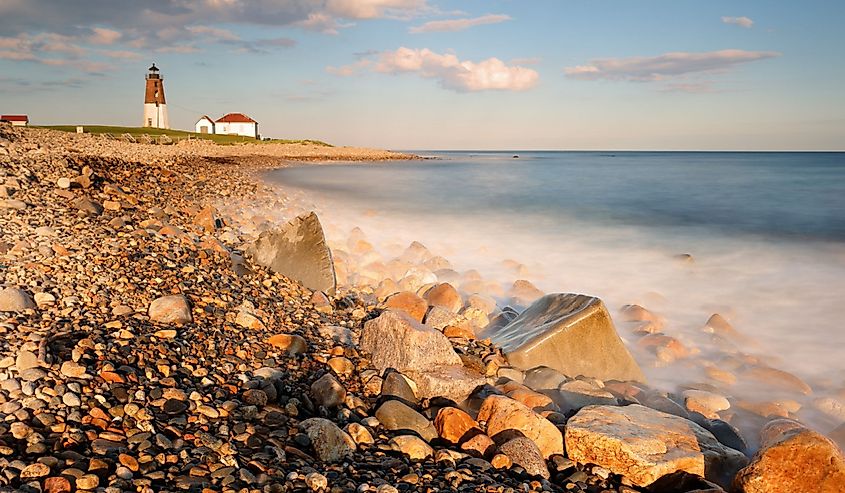 Point Judith Lighthouse along the beach at sunset at Narragansett