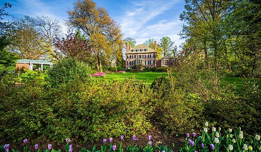 Gardens and large home at Sherwood Gardens Park, in Baltimore, Maryland.