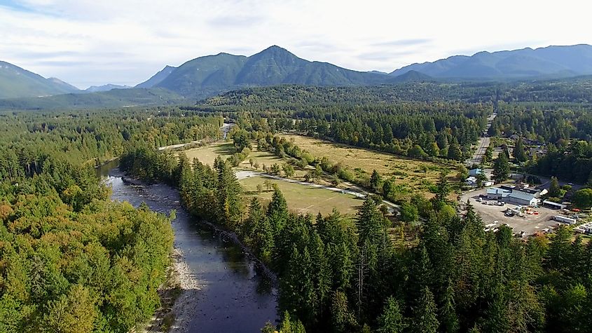 Aerial view of North Bend, Washington with Preacher Mountain and Snoqualmie River. 
