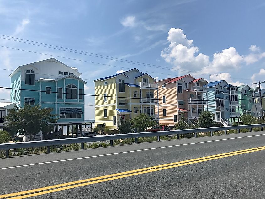 Colorful beach houses lining the streets of Fenwick Island, Delaware, with vibrant hues and coastal charm.