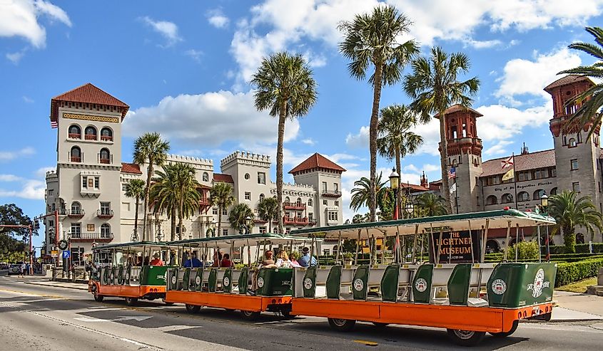 Trolley Tour, Casa Monica Hotel and Lightner Museum on lightblue cloudy sky background at Old Town in Florida's Historic Coast