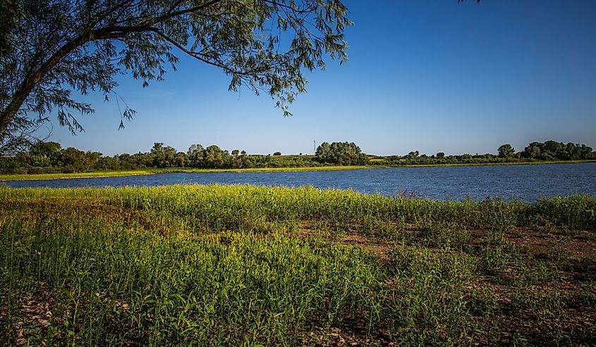 Green grass surrounding El Dorado Lake in Butler County, Kansas