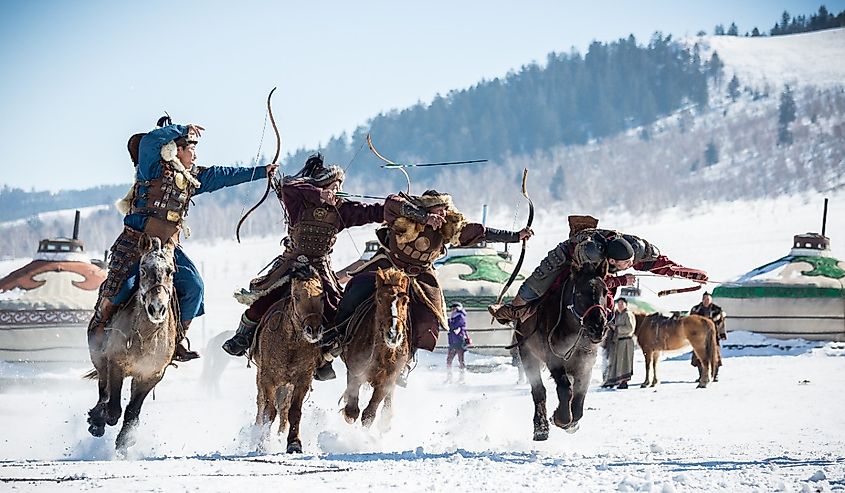 Master skill for mongolian archery aim single target while riding horseback.traditional show in golden eagle festival winter