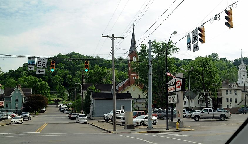 Aurora, Indiana, small town street corner intersection with church steeple and hills in the background