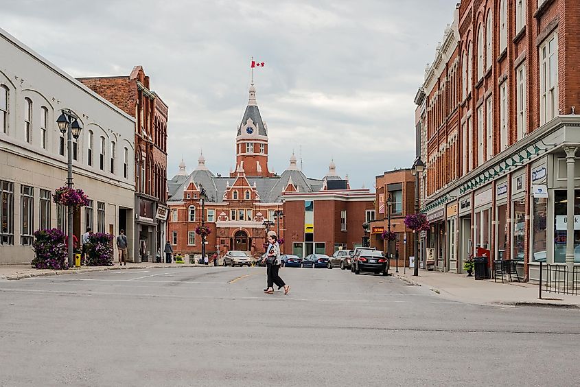 Stratford, Ontario, Canada: People crossing the street with the town hall building in the background.