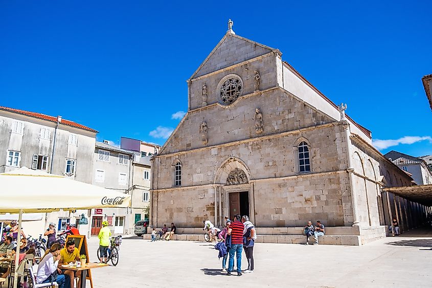 The historic Church of St. Mary dominates the bustling town square of Pag