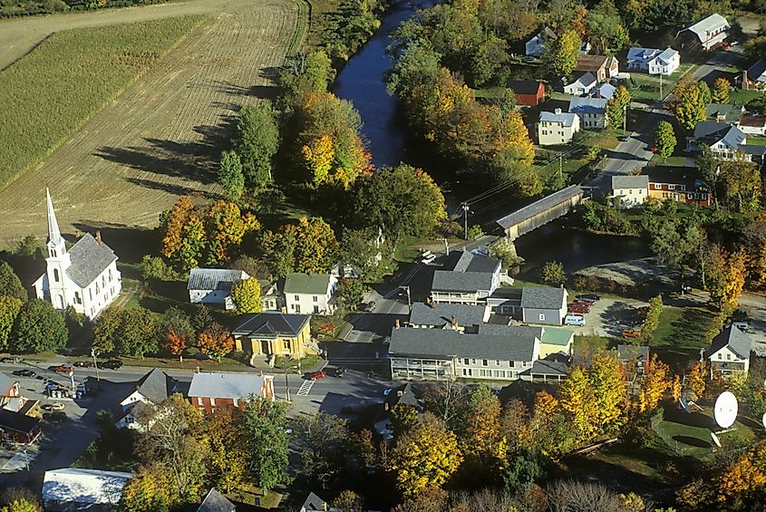 Aerial view of Waitsfield, Vermont and the Mad River on Scenic Route 100 in autumn.