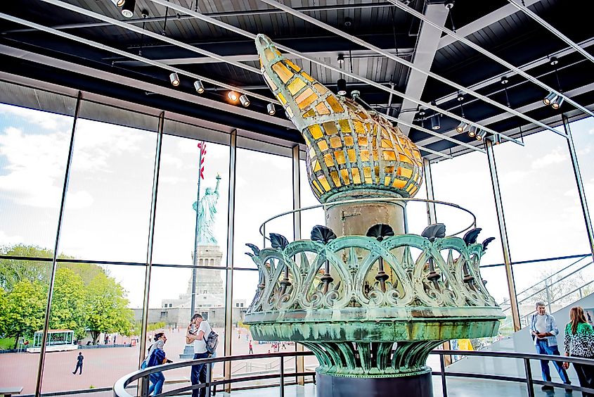 Tourists visit the Statue of Liberty and Museum on Liberty Island just off the coast of Lower Manhattan