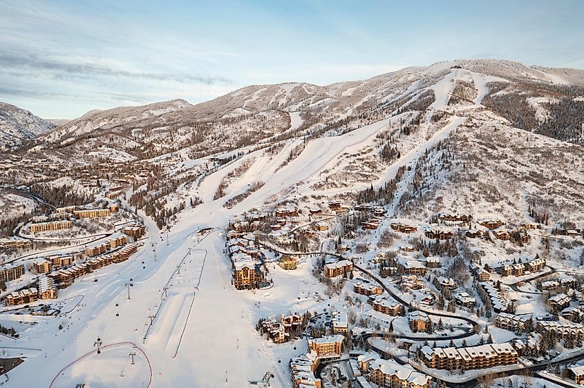 Aerial view of ski resort and mountain town of Steamboat Springs, Colorado with winter landscape and Mt. Werner