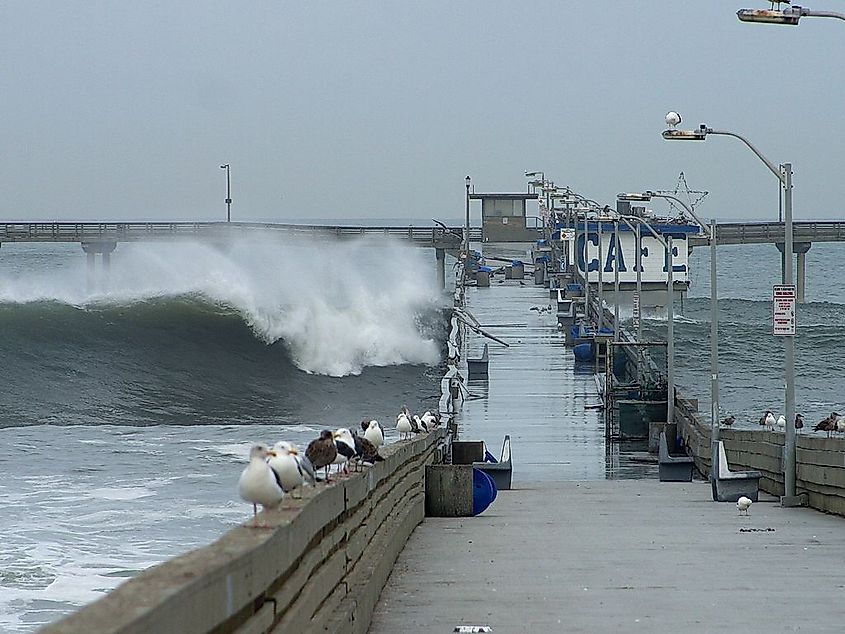 Waves crashing over the Ocean Beach Pier