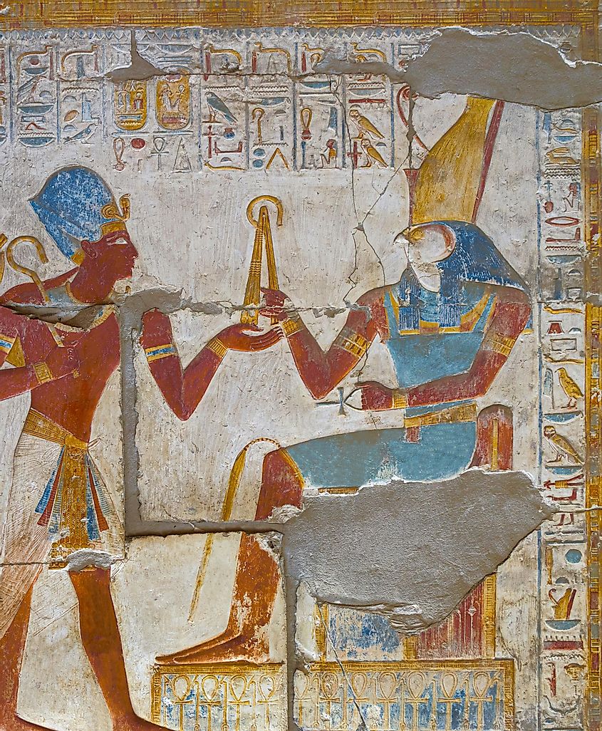 Pharaoh Seti I with a khopesh in front of Horus at Abydos Temple. Egypt.