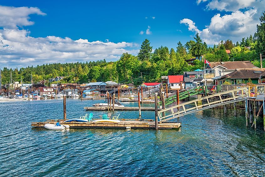 Cowichan Bay boats and wooden homes on a beautiful summer day, Vancouver Island - Canada.