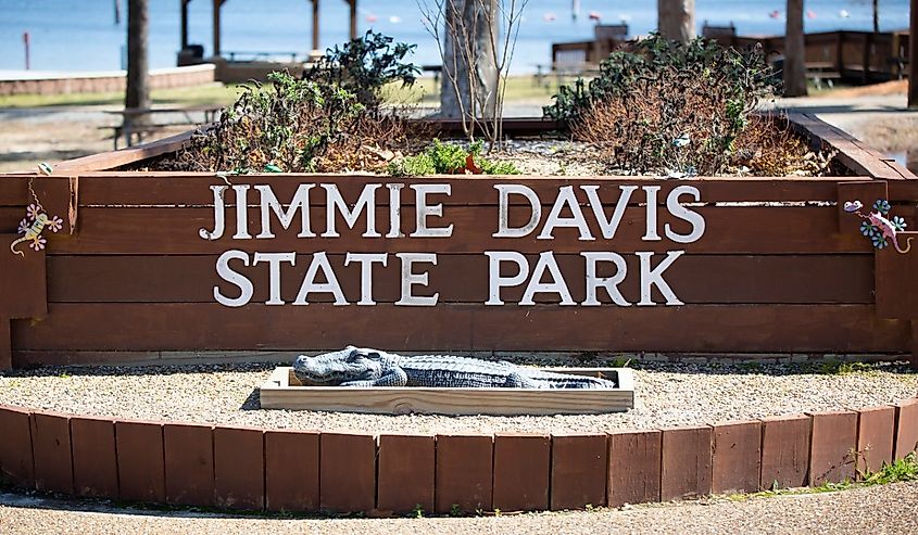 Brick sign and a metal alligator at the Jimmie Davis State Park near Chatham, Louisiana