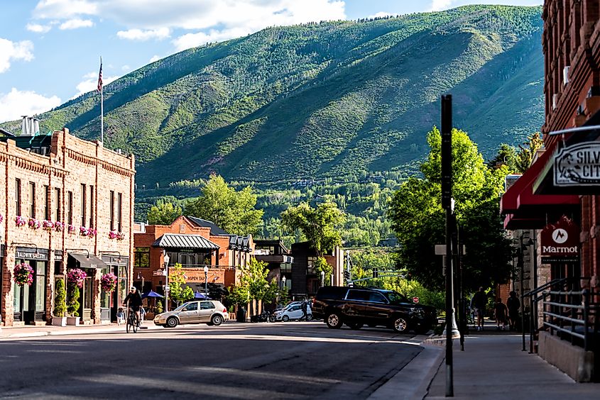 Aspen, USA - June 27, 2019: Town in Colorado with retro brick architecture on South Galena street sunny day, via Kristi Blokhin / Shutterstock.com