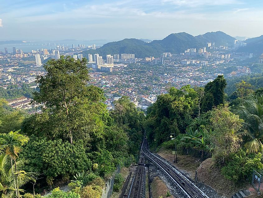 A steep railway descends through the jungle to the waterfront city of George Town, Malaysia.