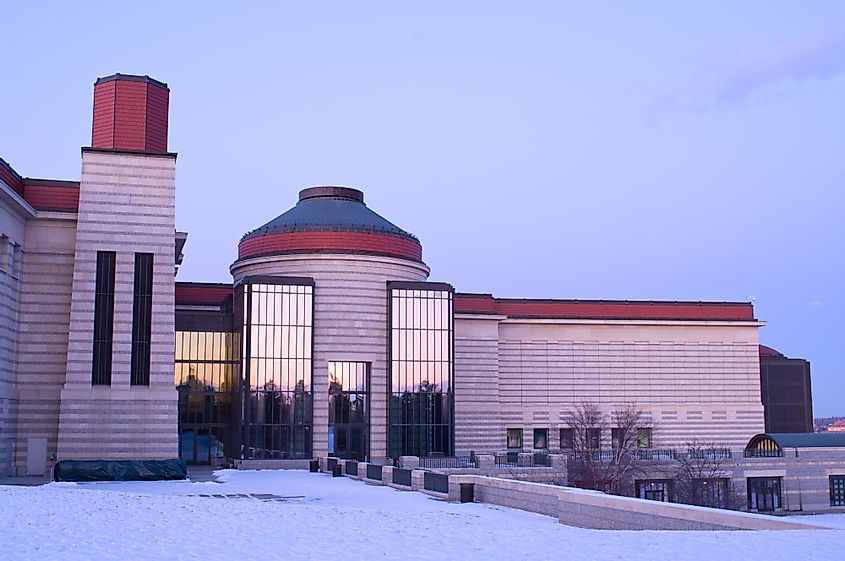 A view of the Minnesota History Center building exterior and terrace in Saint Paul at dusk
