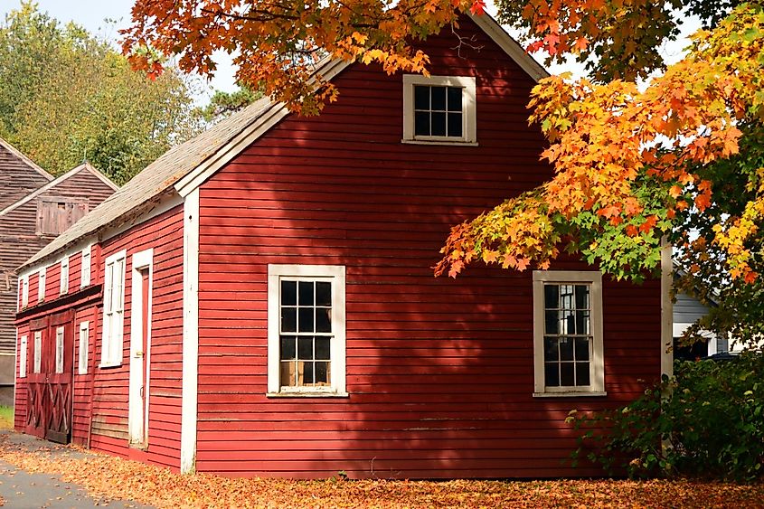 A red barn blends with the fiery New England autumn foliage in Chesterfield, New Hampshire.