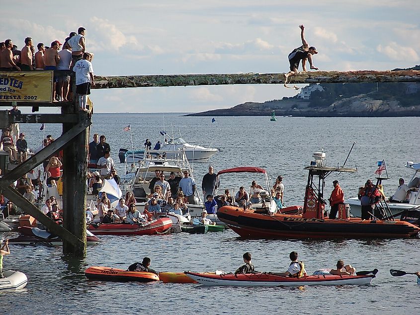 A man attempts to reach the flag during the courtesy round of the Greasy Pole on Sunday, July 1, 2007.