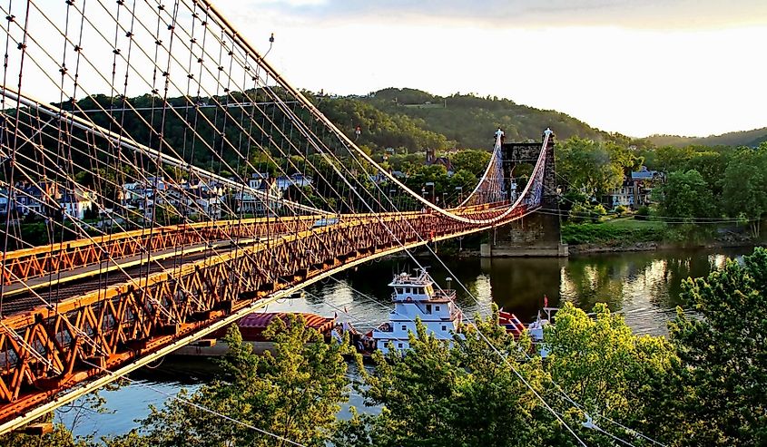 Barge going under the Famous Suspension Bridge at Wheeling, West Virginia