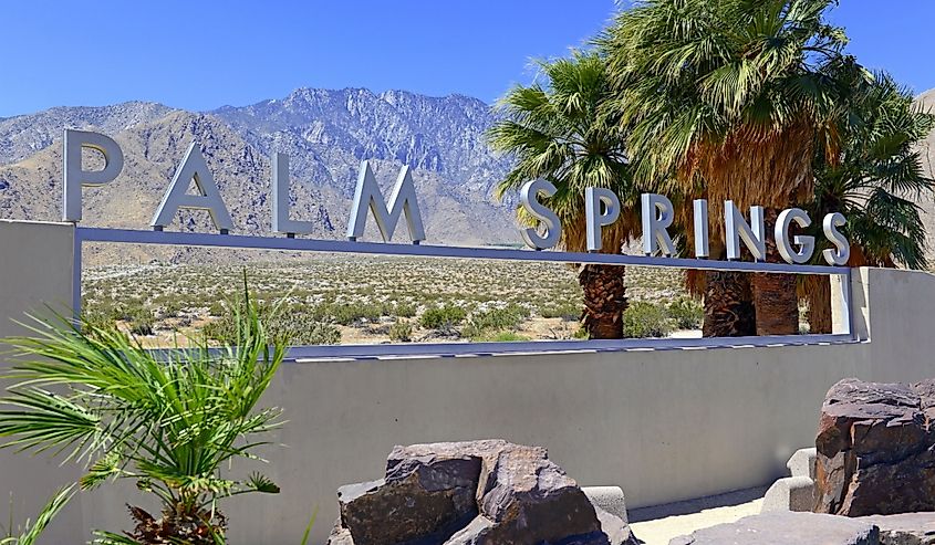 Palm Springs sign with desert background and backdrop of San Jacinto Mountain, California