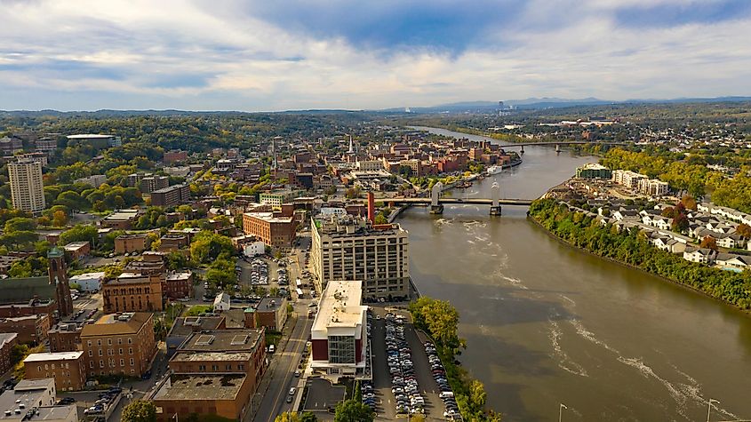 Tugboat and Downtown Troy NY in Rensselaer County along the banks of the Hudson River