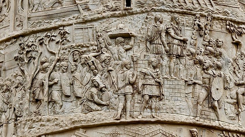 A section of Trajan’s Column depicts a Roman ceremony with troops, standards, and offerings from defeated peoples before officers.