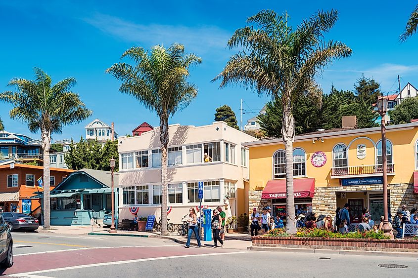 People enjoy a sunny day in downtown Capitola, California.