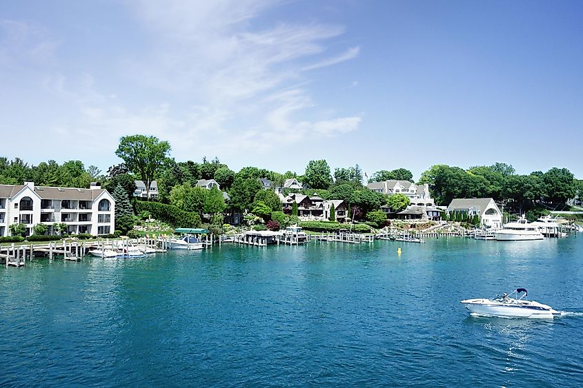 Lakefront homes and boats in the Round Lake in downtown Charlevoix, Michigan