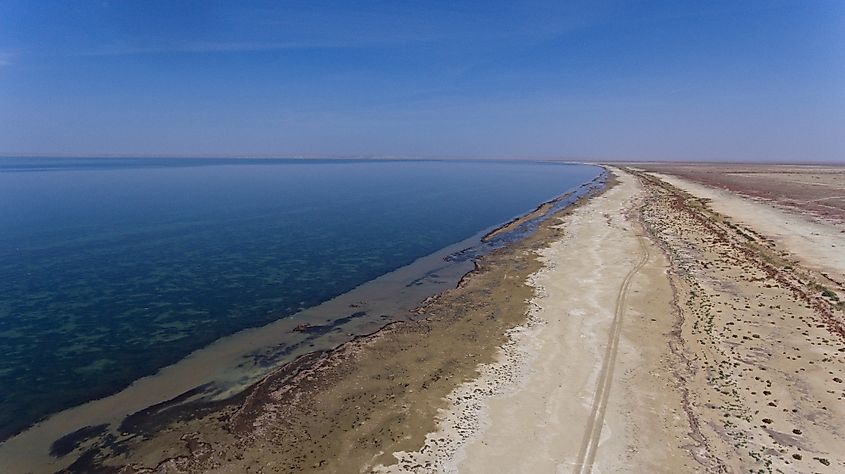 Exposed coastline of the Aral Sea in Kazakhstan, showing receding water levels and dry lakebed