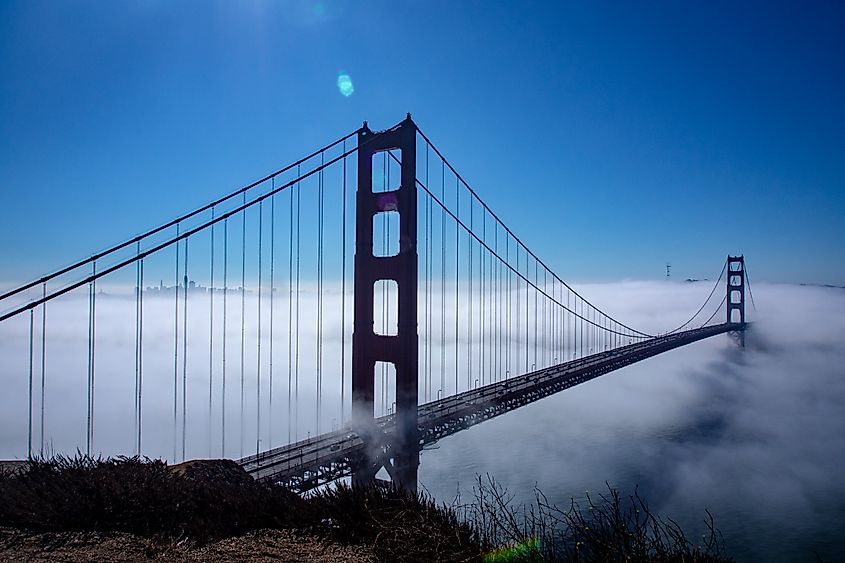 The Golden Gate Bridge rising above the fog, photographed from Battery Spencer in the Marin Headlands, California