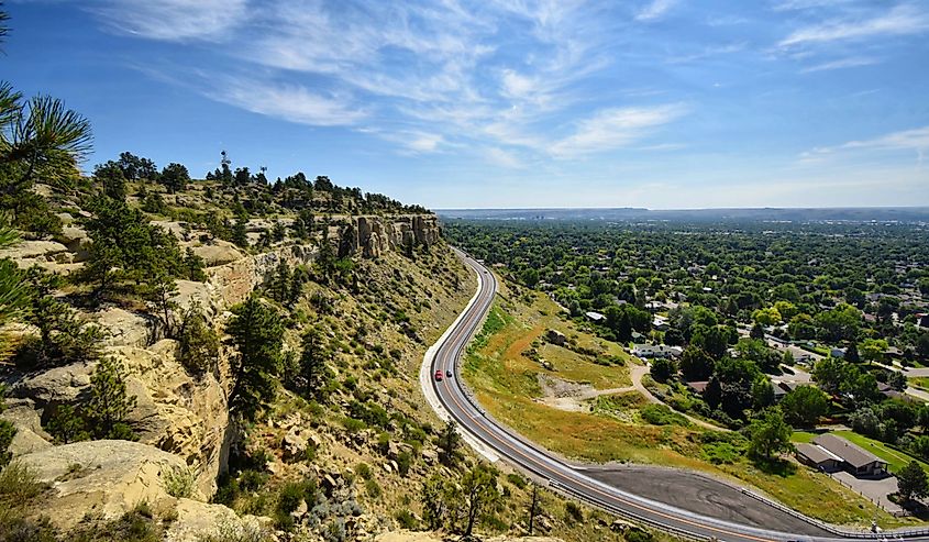 A road winds through Billings Montana. Very few people on the roads driving.