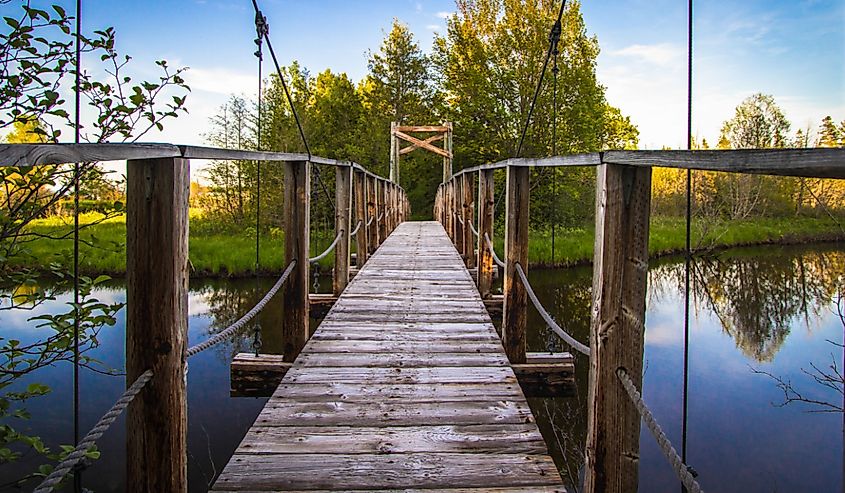 North Country Trail In Michigan. Footbridge over a river in the Hiawatha National Forest on the North Country Trail in the Upper Peninsula of Michigan.