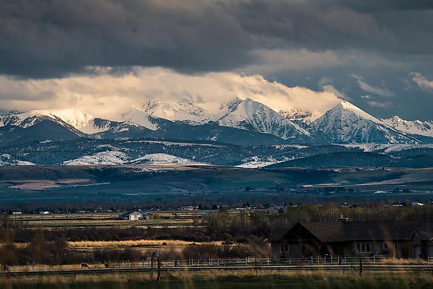 Clouds form over the Tobacco Roots Mountains during sunset in Montana