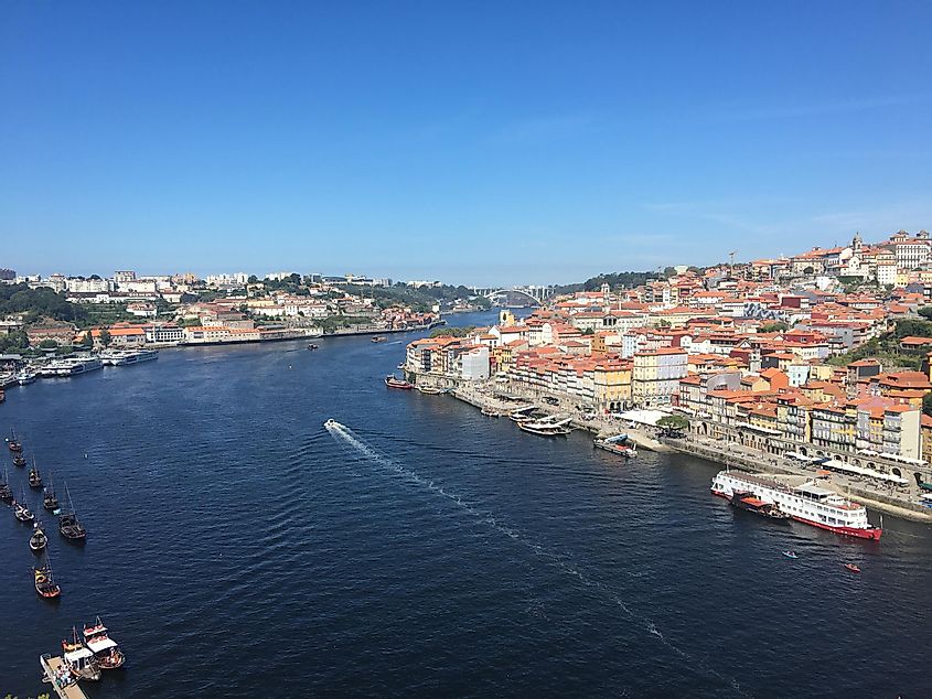 The beautiful architecture and waterways of Porto, Portugal, as seen from the major bridge. 