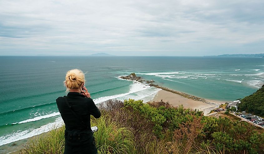 Tourist and local people visit Mangawhai Head beach in Northland region, New Zealand.